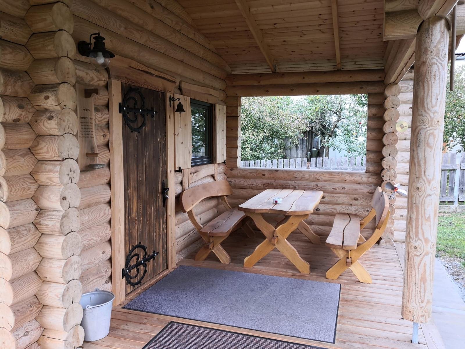Interior of a TimberTeam solid timber pavilion with table and benches