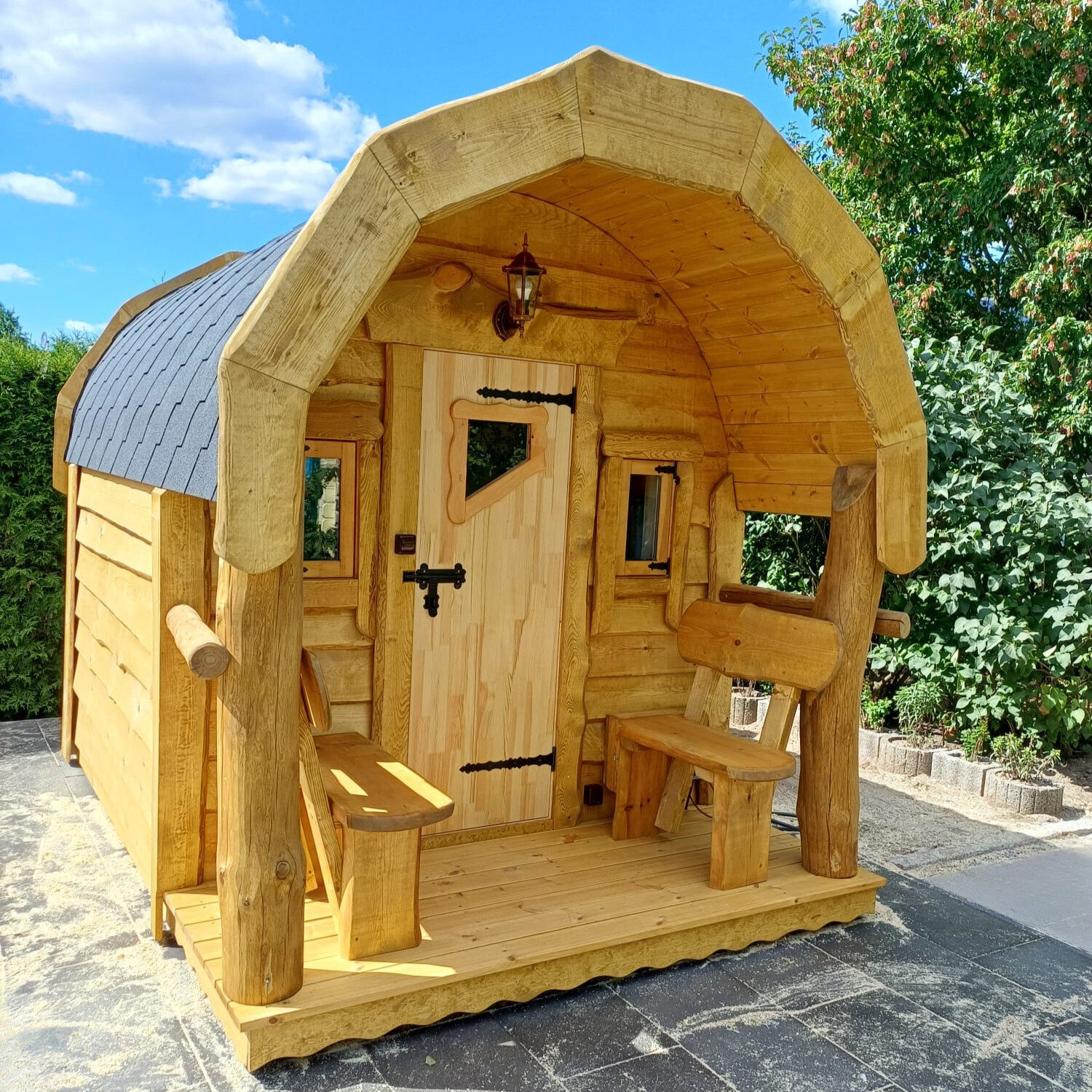 TimberTeam outdoor sauna with covered entrance